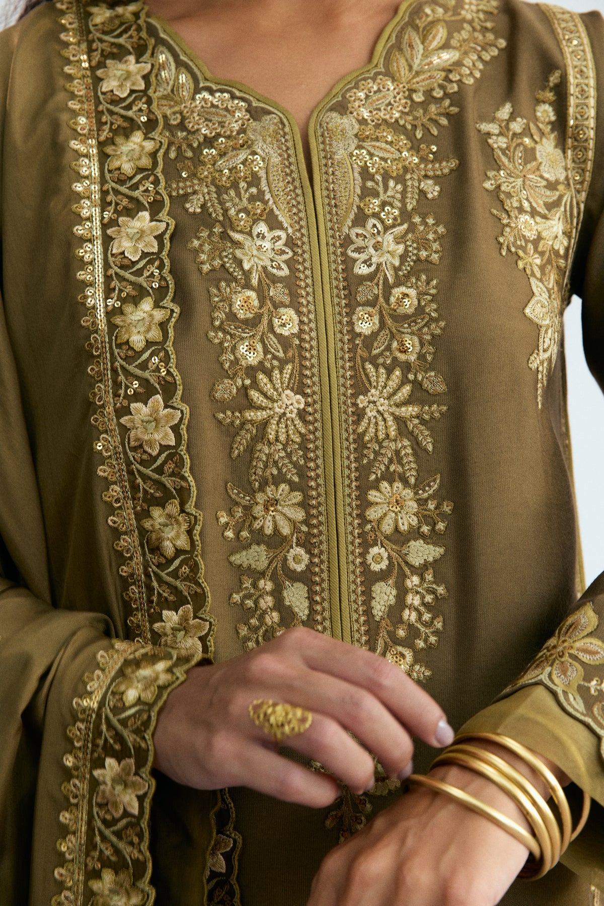 Close-up of hand-stitched sequin detailing and organza trimmings