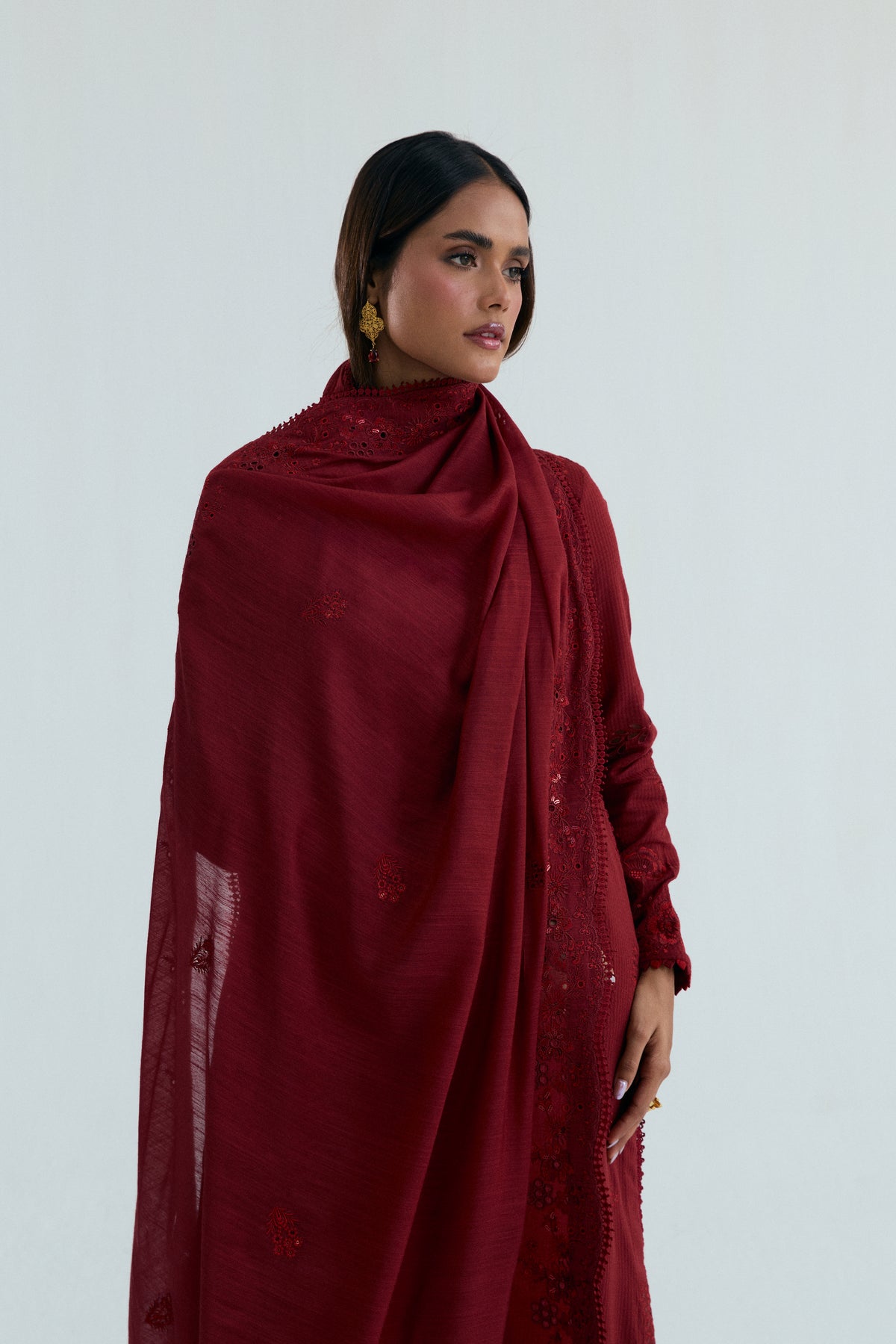 Maroon asian dupatta draped over embroidered cotton kameez