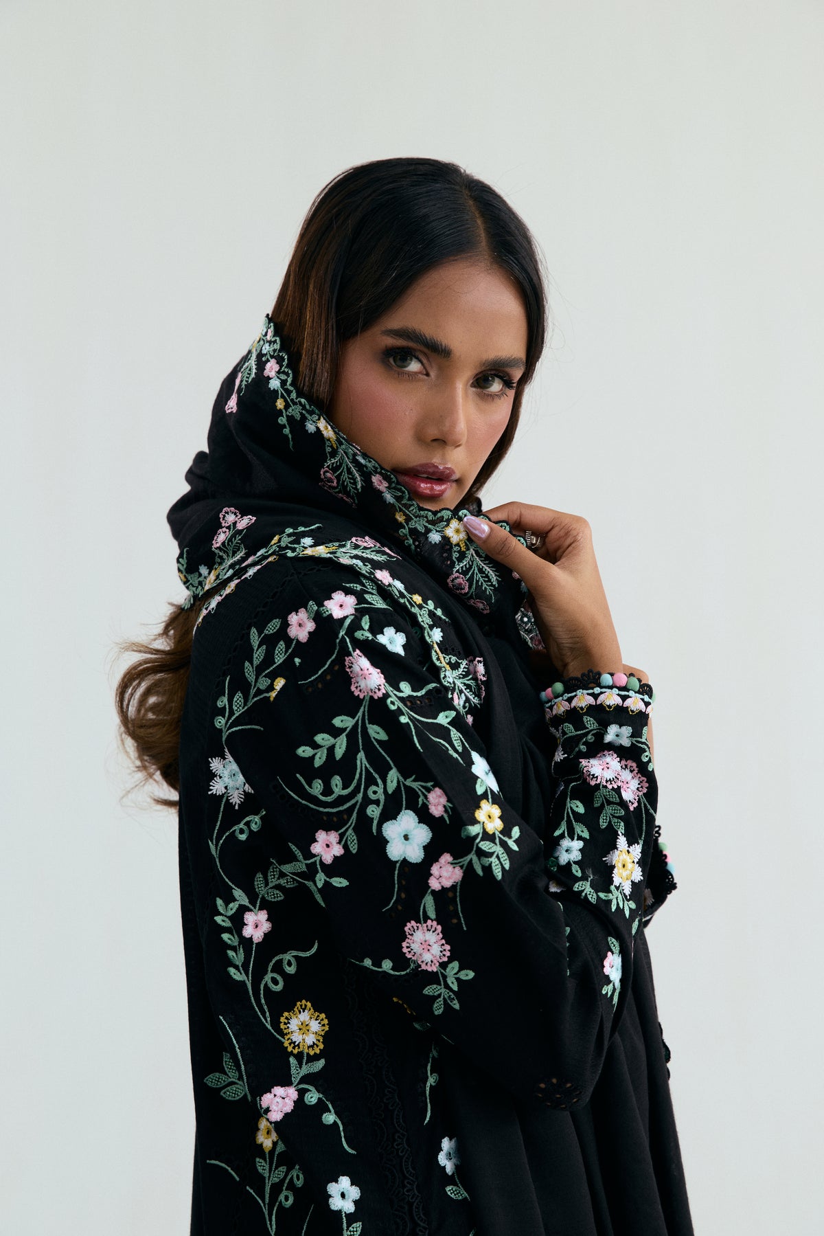 Model wearing black embroidered 3-piece Pakistani cotton kameez