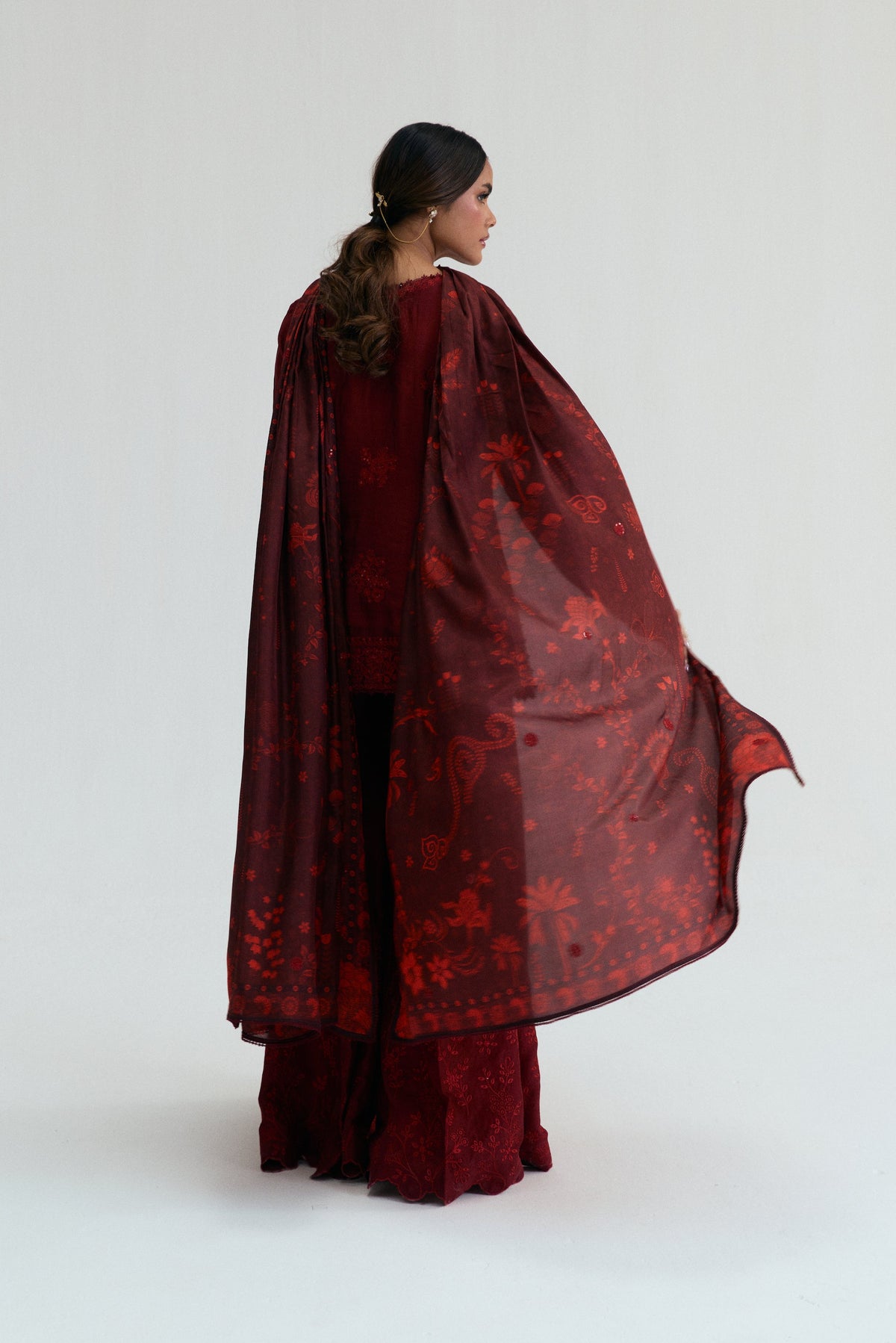 Deep red Pakistani angrakha set with Aari-inspired sequin work, crystal pearls, tassels and embroidered flared trousers — Cherry Set by Mannam