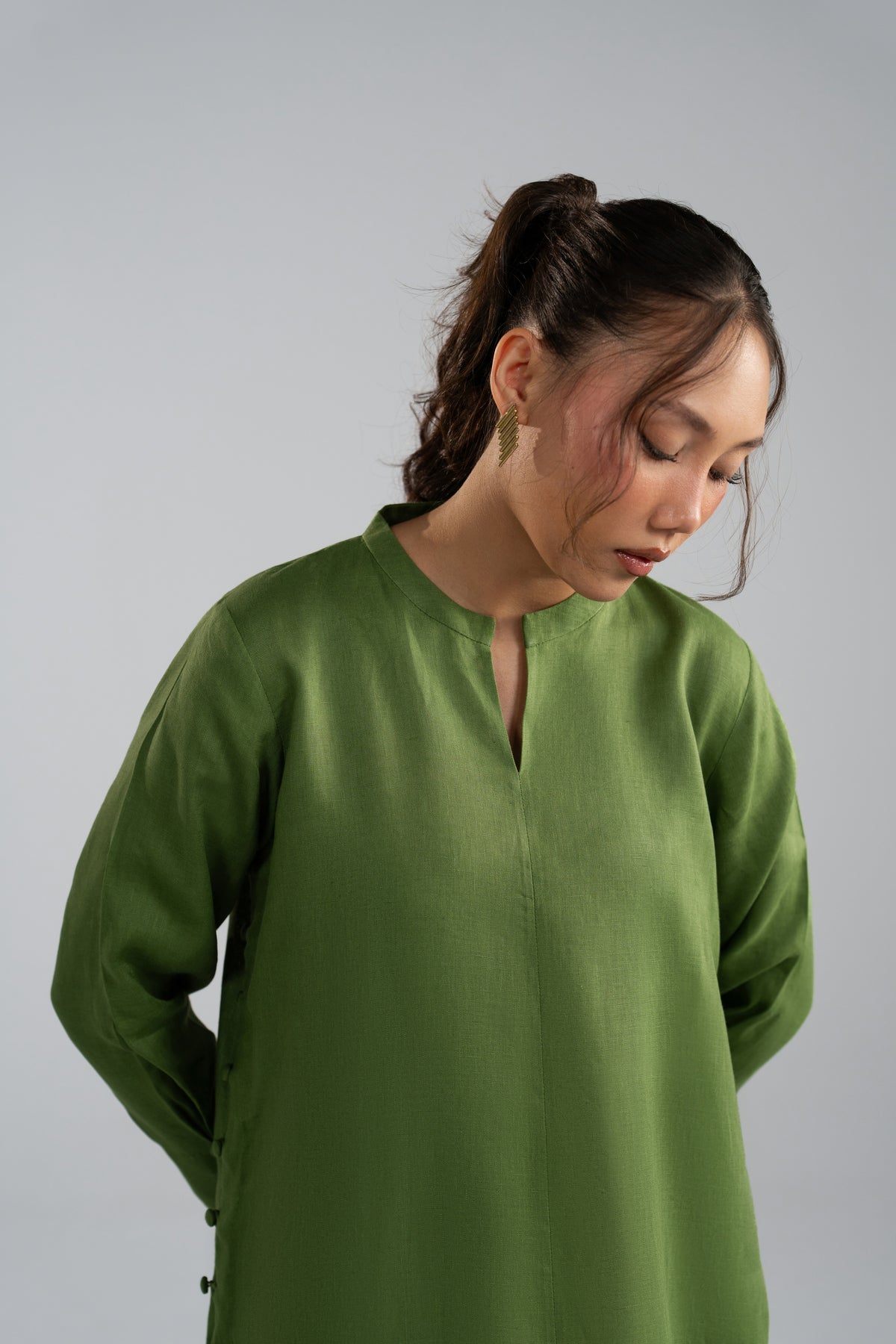 Close-up of Fern Set V-neckline and front slit detail