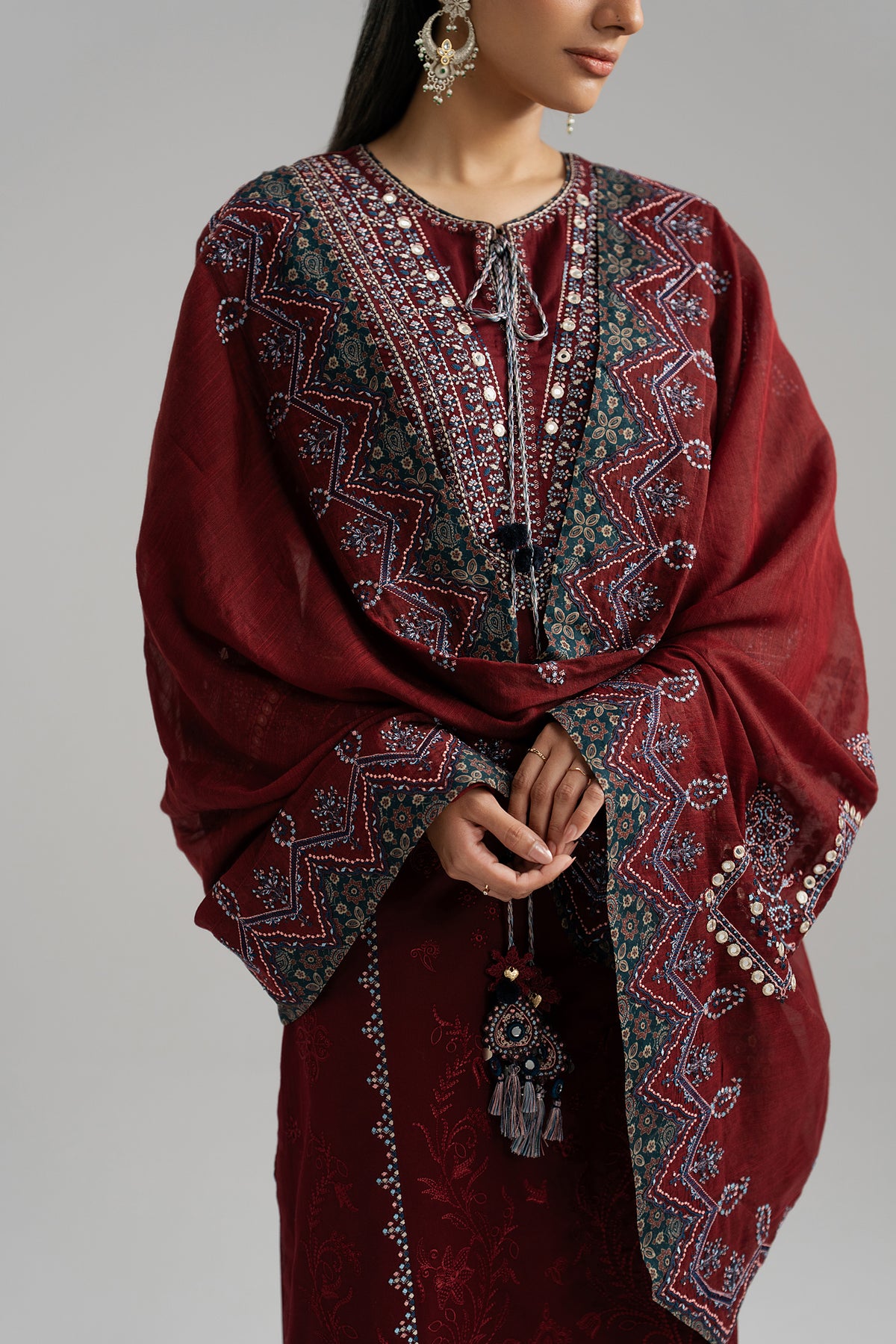 Saffron Set worn — deep maroon cotton kameez and wide-leg embroidered trousers | Mannam Pakistan