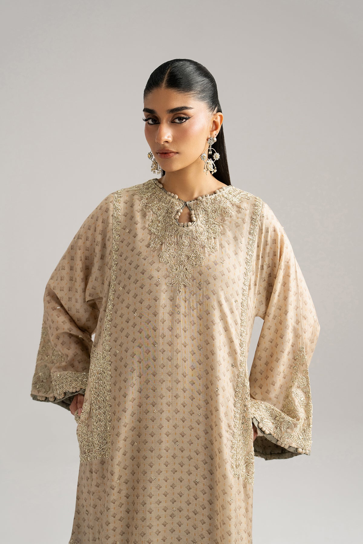 Embroidered pocket detail — tilla dori and sequins on ivory silk phiran pockets