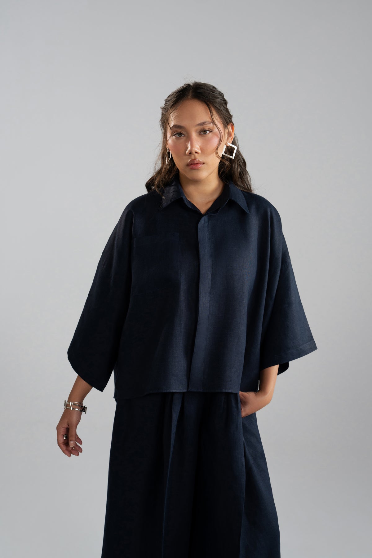 Indigo Set cropped shirt hem detail, front view