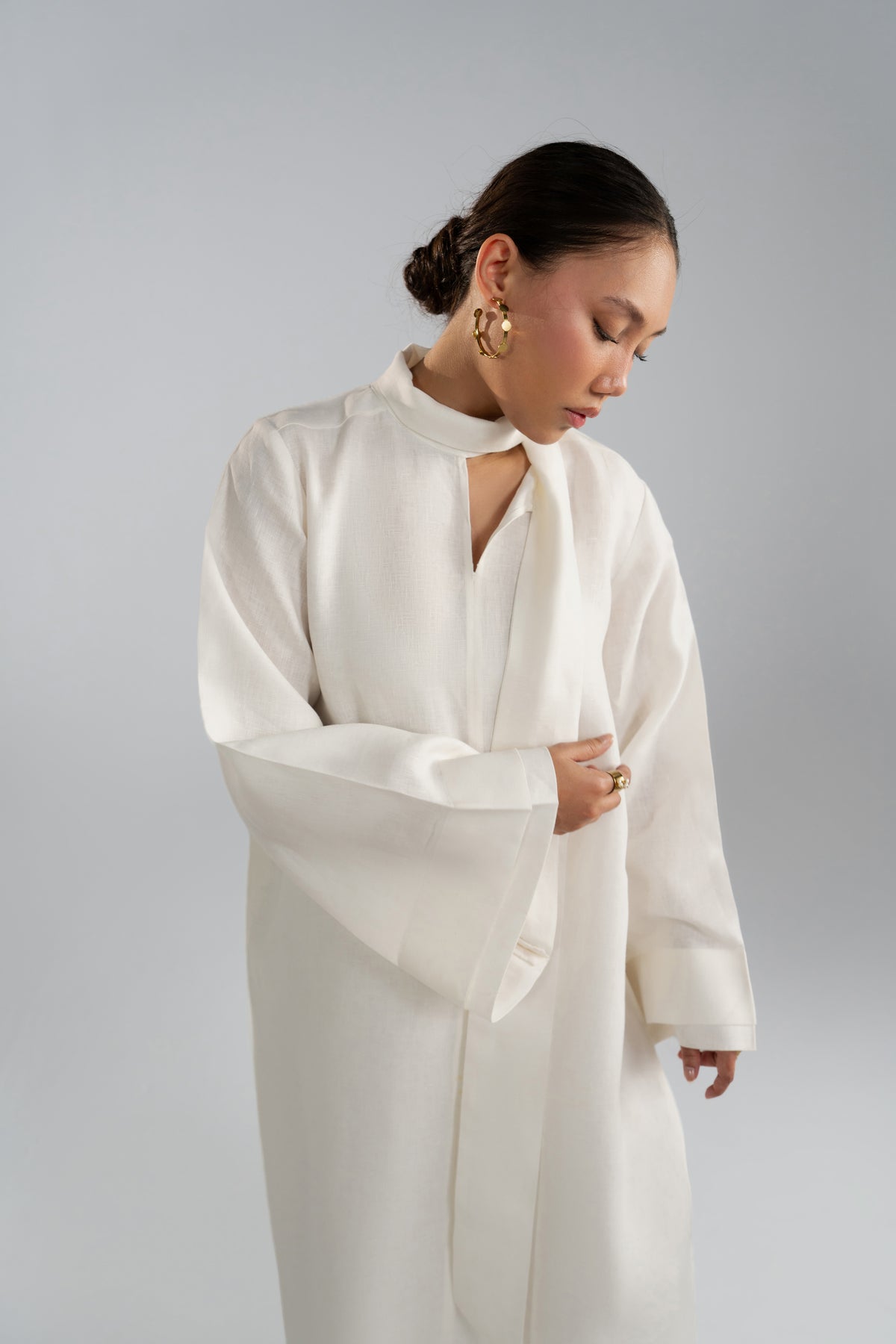 Integrated scarf neckline with slit detail on the Mist Set tunic