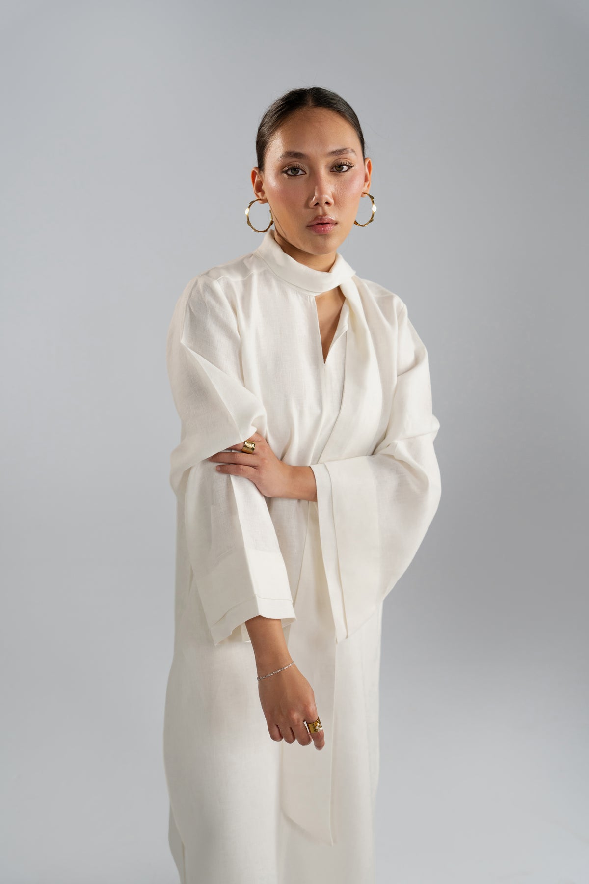 Scarf tail styling detail on Mist Set tunic neckline