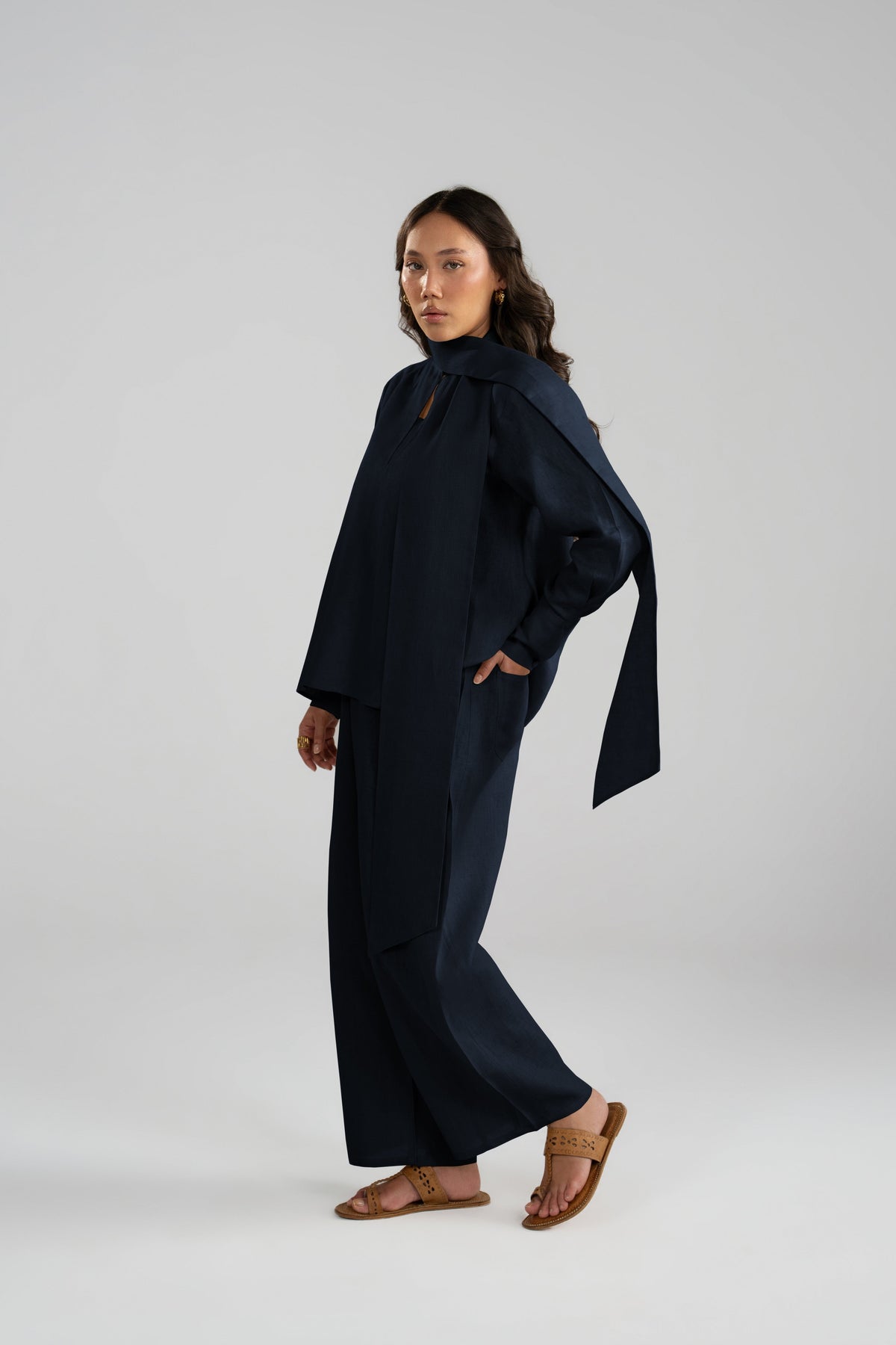 Navy linen three piece suit, side view of shirt and balloon trousers