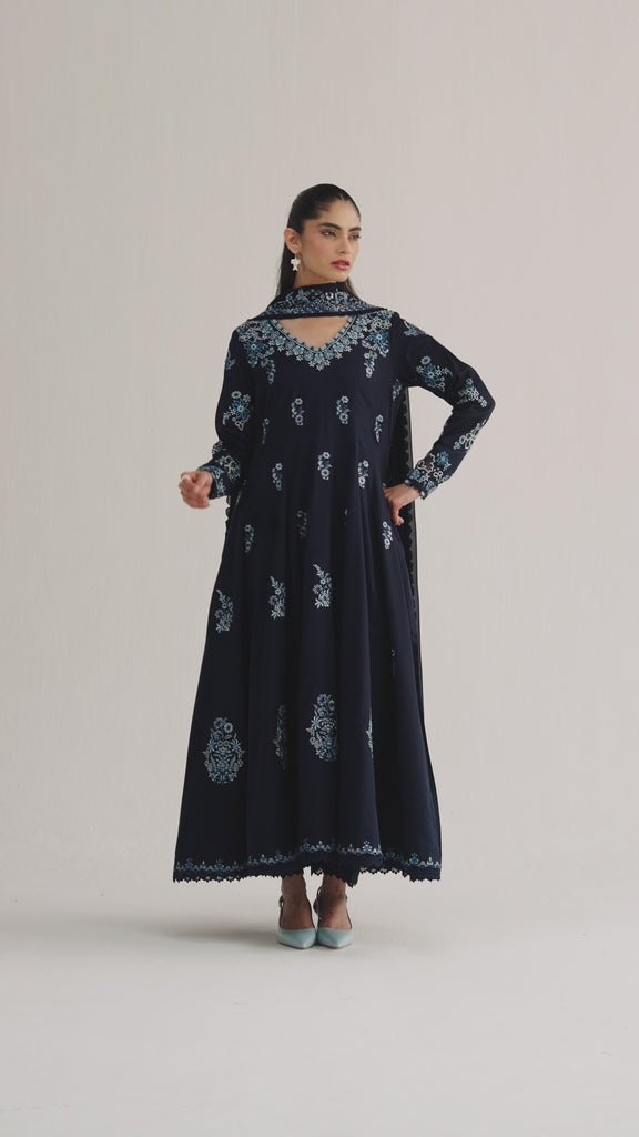 The Sapphire Set is a sapphire blue Pakistani Kalidaar kameez in Pima cotton with organza appliqué, multicolour loop accents, and lace-finished pencil trousers